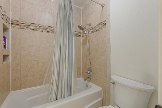 bathroom featuring toilet and shower / bath combination with curtain