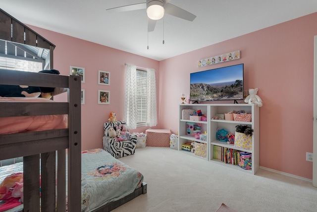 bedroom featuring ceiling fan and light carpet