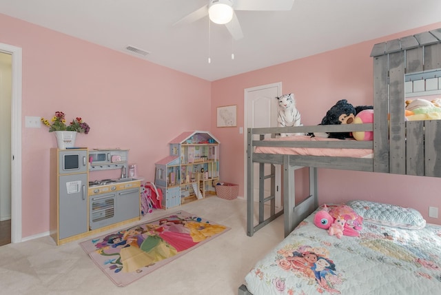 carpeted bedroom featuring ceiling fan