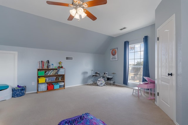 game room featuring ceiling fan, vaulted ceiling, and carpet flooring