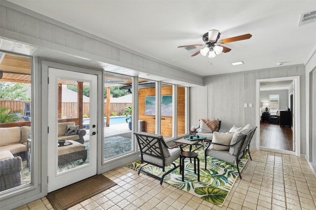 sunroom / solarium with ceiling fan