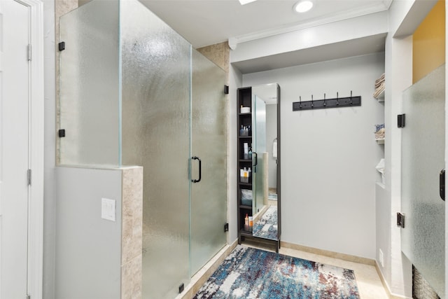 bathroom with walk in shower, tile patterned flooring, and crown molding