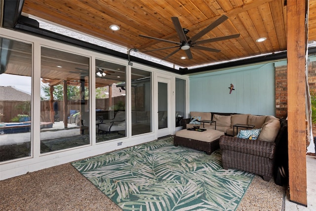 sunroom / solarium with ceiling fan and wooden ceiling