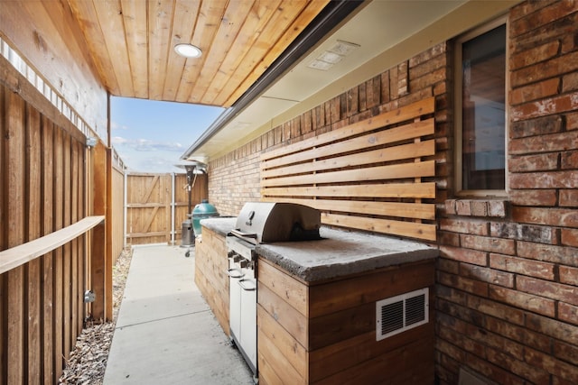 view of patio / terrace with an outdoor kitchen and grilling area