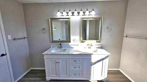 bathroom featuring vanity and hardwood / wood-style flooring