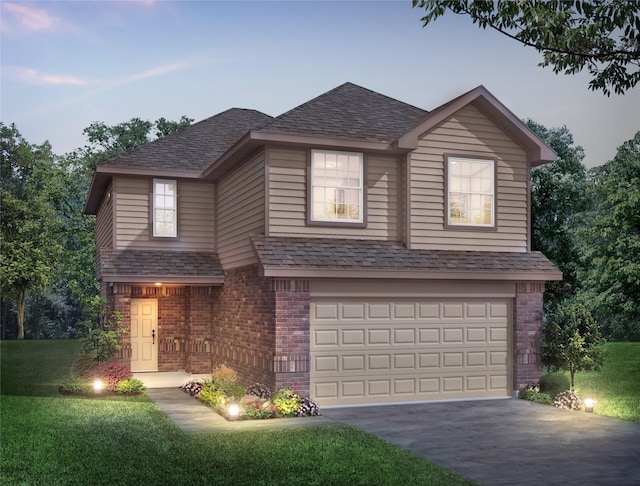 view of front property with a garage and a lawn