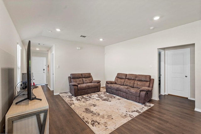 living room featuring dark wood-type flooring