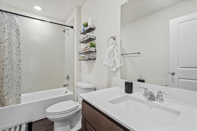 full bathroom featuring toilet, shower / bathtub combination with curtain, hardwood / wood-style floors, and vanity