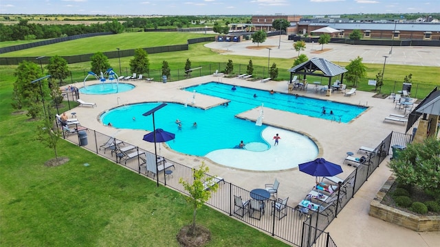 view of pool with a gazebo, a lawn, and a patio