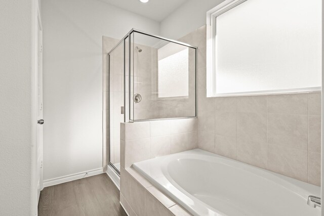 5041 Wellborn Rd, Fort Worth, TX 76036 - full bath with a shower stall, a garden tub, and wood finished floors