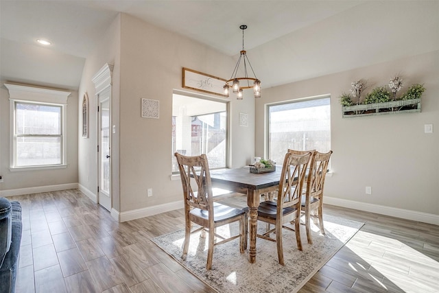 dining space with an inviting chandelier