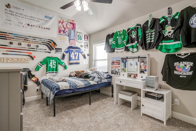 bedroom with ceiling fan, light colored carpet, and vaulted ceiling