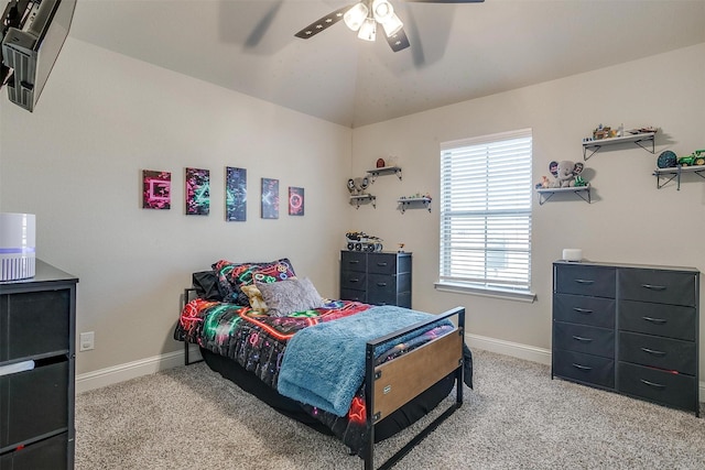 carpeted bedroom featuring ceiling fan and lofted ceiling