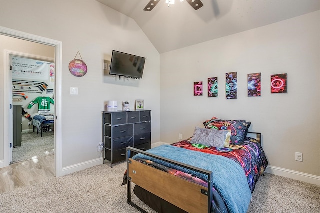 bedroom featuring light carpet, ceiling fan, and lofted ceiling