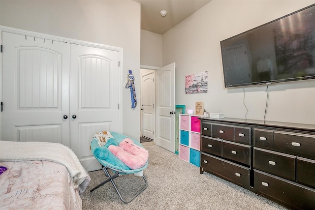 carpeted bedroom with a closet