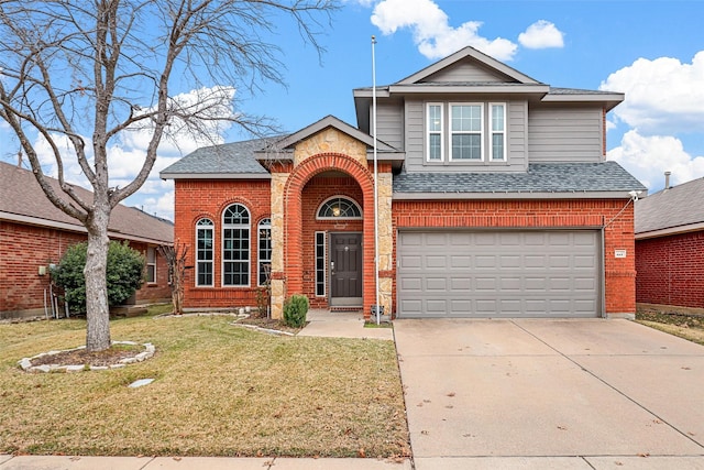 view of front property featuring a garage and a yard