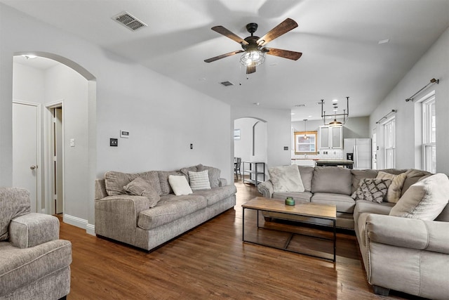 living room with ceiling fan and hardwood / wood-style floors