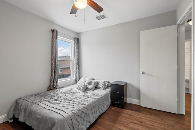 bedroom featuring ceiling fan and dark wood-type flooring