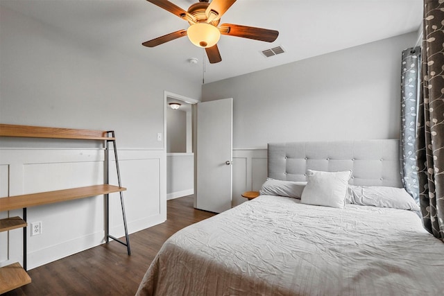 bedroom with ceiling fan and dark hardwood / wood-style flooring