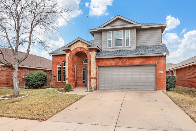 view of front property with a garage and a front lawn