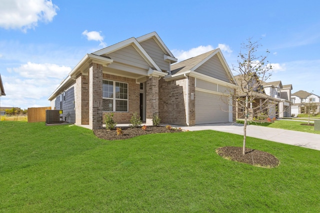 craftsman inspired home featuring central AC unit, a front lawn, and a garage