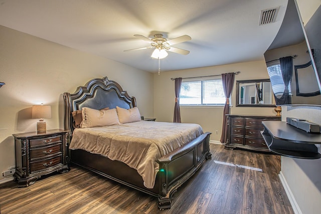 bedroom featuring ceiling fan and dark hardwood / wood-style flooring