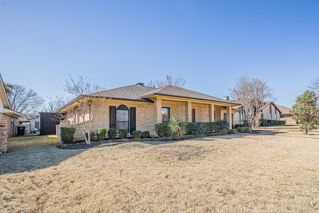 single story home featuring a front yard