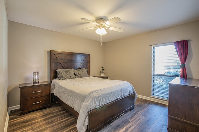 bedroom with ceiling fan and dark hardwood / wood-style floors