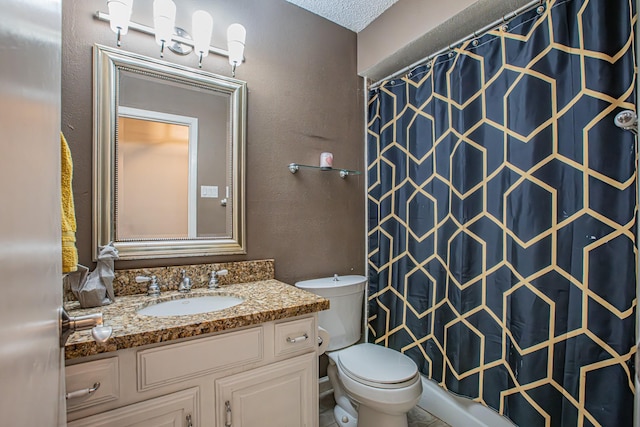 bathroom featuring toilet, a textured ceiling, a shower with curtain, and vanity