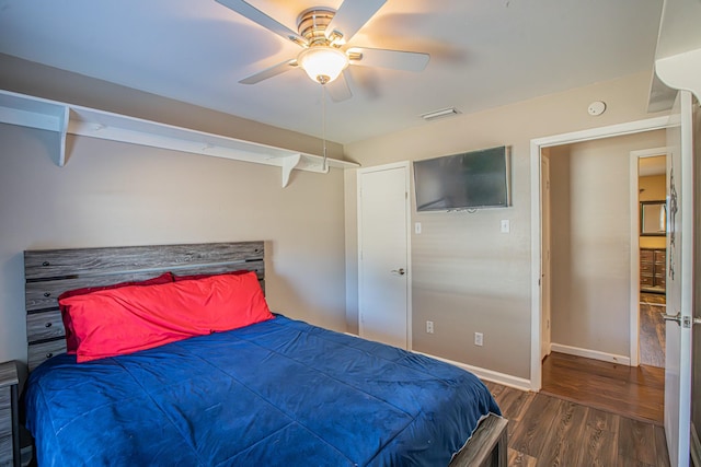 bedroom featuring ceiling fan and dark hardwood / wood-style floors