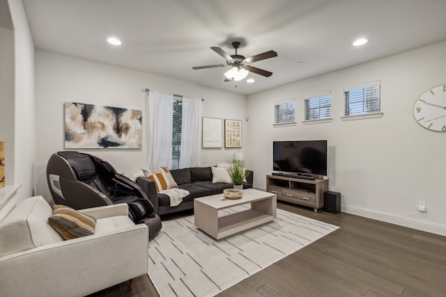 living room featuring ceiling fan and hardwood / wood-style floors