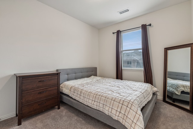 bedroom featuring light colored carpet