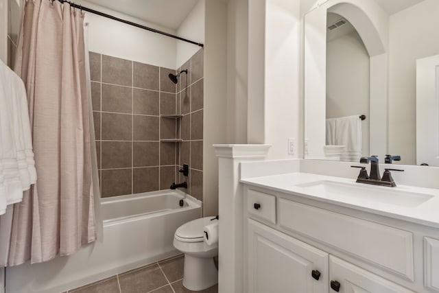 full bathroom with toilet, vanity, tile patterned floors, and shower / bath combination with curtain