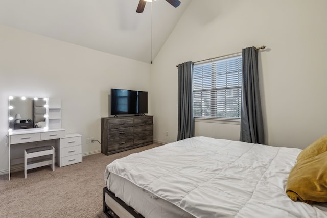 carpeted bedroom with ceiling fan and high vaulted ceiling