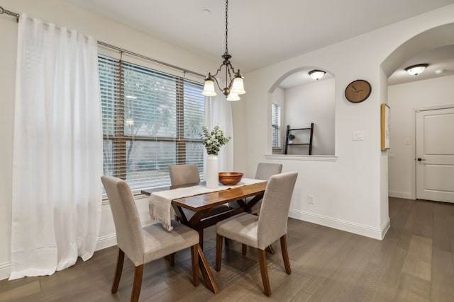 dining area featuring dark hardwood / wood-style floors