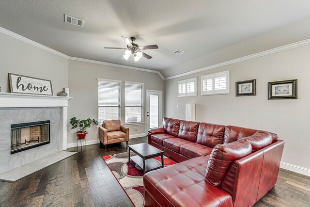 kitchen featuring a center island with sink, a kitchen bar, decorative backsplash, stainless steel appliances, and dark hardwood / wood-style flooring