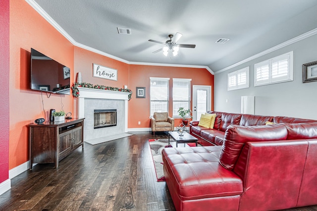 living room with lofted ceiling, ceiling fan, dark hardwood / wood-style floors, and ornamental molding