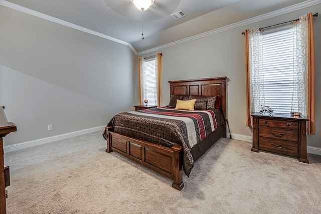 bedroom featuring ceiling fan, light carpet, vaulted ceiling, and ornamental molding