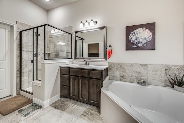 bathroom featuring separate shower and tub and vanity