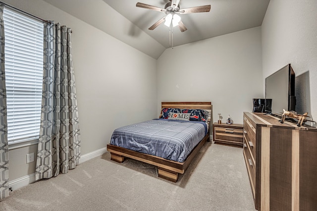 carpeted bedroom featuring vaulted ceiling and ceiling fan