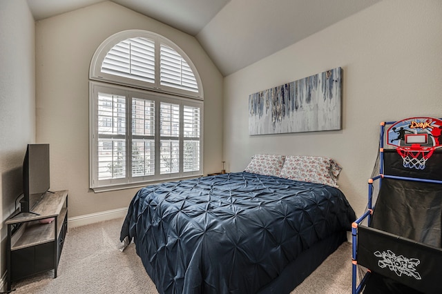 bedroom with lofted ceiling and carpet flooring