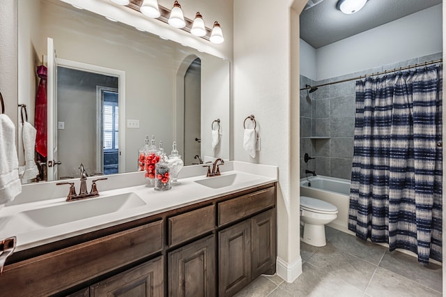 full bathroom with toilet, vanity, shower / bathtub combination with curtain, and tile patterned flooring