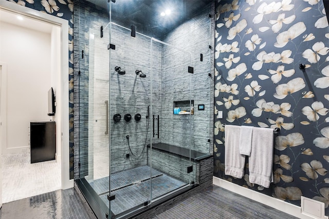 bathroom featuring hardwood / wood-style flooring and an enclosed shower