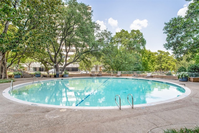 view of swimming pool featuring a patio