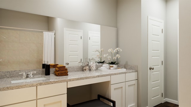 bathroom featuring vanity and a shower with curtain