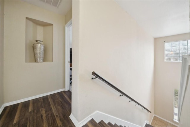 stairway with wood-type flooring