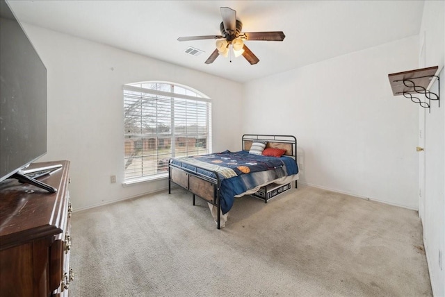 carpeted bedroom with ceiling fan