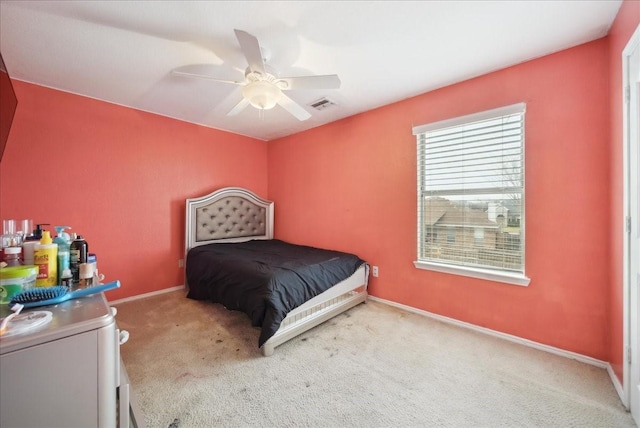 carpeted bedroom featuring ceiling fan