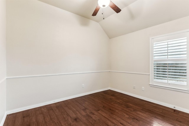 spare room featuring ceiling fan, lofted ceiling, and wood-type flooring