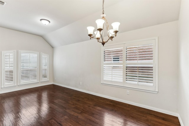 unfurnished room with dark wood-type flooring, lofted ceiling, and an inviting chandelier